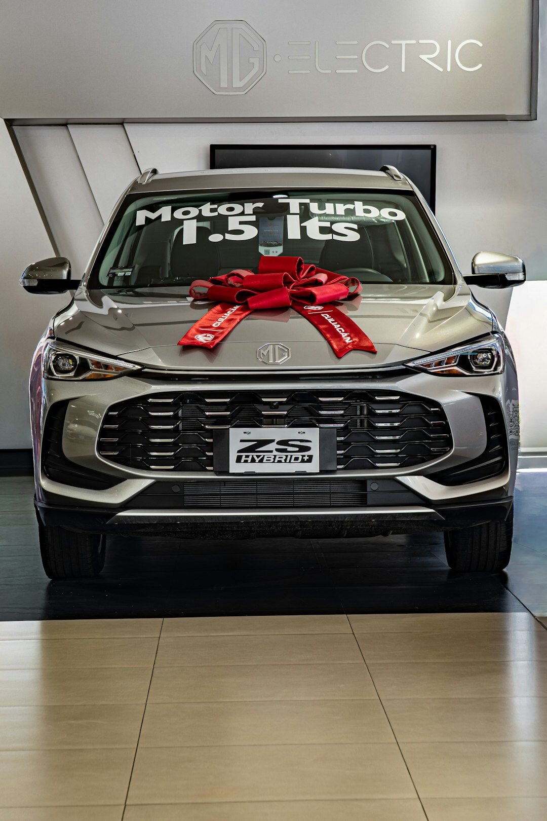 Grey hybrid SUV parked outdoors