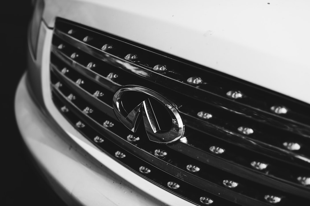 Close-up of a car front badge and grille