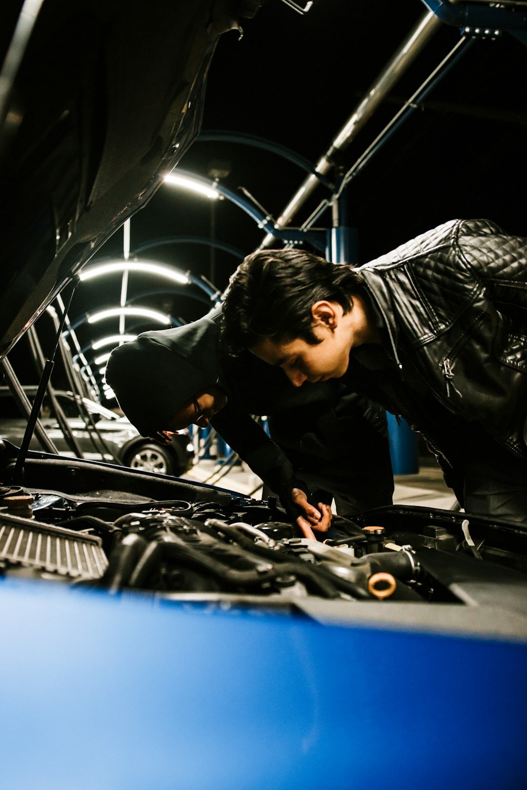 Mechanic inspecting a car engine
