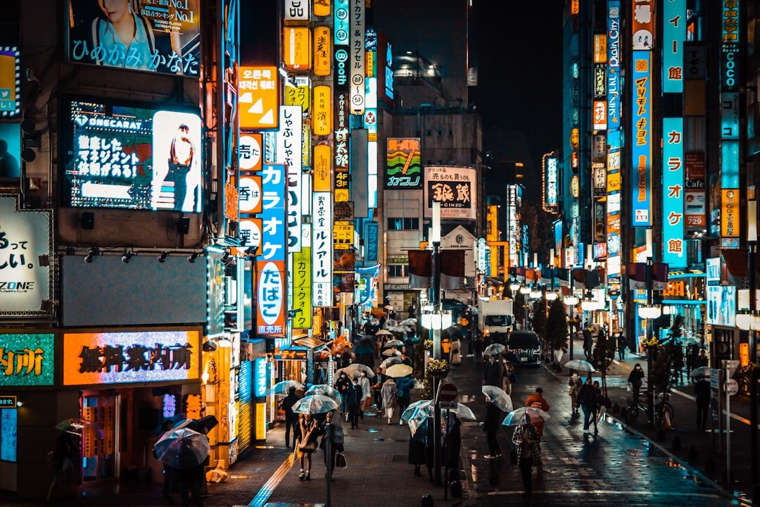 Tokyo city street at night with neon lights